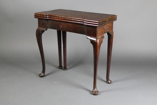 A George III mahogany rectangular flip over tea/games table, fitted a drawer, raised on cabriole supports 29"h x 32"w x 16"d 