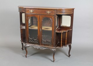A Victorian walnut chiffonier/sideboard of shaped outline with drawer above a double cupboard flanked by a pair of niches, raised on cabriole supports 41 1/2"h x 48"w x 13 1/2"d