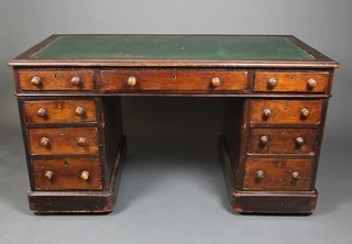 A Victorian mahogany kneehole desk with green leather inset writing surface above 1 long and 8 short drawers 29"h x 54"w x 27"d 