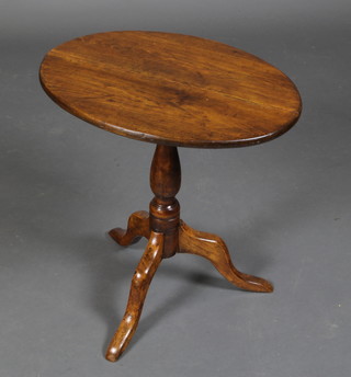 A 19th Century oval pine and mahogany snap top wine table, raised on a pillar and tripod base (some old worm to base) 22"h x 21"w x 15"d 