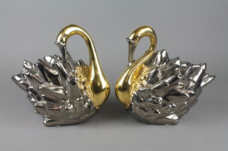 A pair of 2 colour glazed porcelain figures of swans 10" 