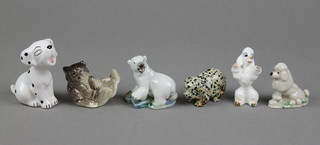 A Wade figure of a Polar Bear 1 1/2", a seated Poodle 1", 3 porcelain figures and a hardstone pig 