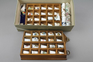 A collection of china collectors thimbles