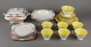 An Art Deco Crown Ducal part dinner service comprising tureen and cover, deep bowl, 6 small plates and an occasional plate, a Shelley yellow ground and gilt tea set