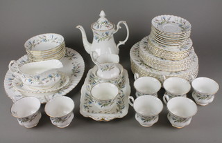 A Royal Albert Brigadoon tea and dinner service comprising 8 tea cups, 8 saucers, tea pot, cream jug, sugar bowl, 7 cake plates, 7 side plates, 8 dinner plates, 8 dessert bowls, a dish, meat plate and a gravy boat and stand