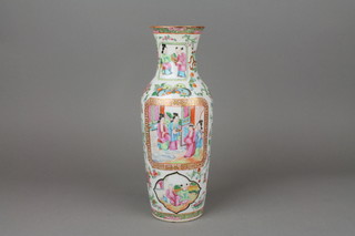 A Cantonese tapered vase decorated with panels of figures in pavillion settings 11" 