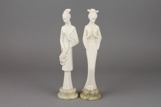 A pair of composition carved figures of Geisha girls on raised alabaster bases 10" 