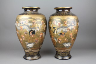 A pair of early 20th Century Satsuma oviform vases the blue and gilt ground decorated with Mon, with panels of figures, seal mark to the base 15" 