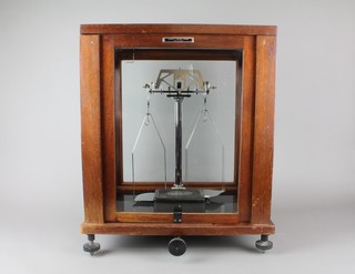 Griffin and George.   A pair of laboratory scales no. 3847 complete with weights 