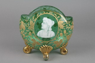 A Victorian green glass Mary Gregory style ovoid vase decorated with a portrait head of a lady, the body with floral gilt decoration on scroll feet 7"  