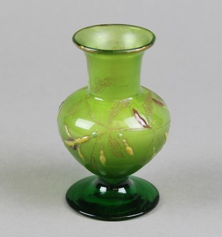 An early 20th Century baluster green glass vase, the painted decoration with flowers bearing the signature Galle Nancy Depose 4" 