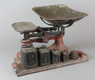 A pair of standard brand domestic pan scales the base incorporating 8 weights weighing 1 oz - 7lbs 