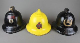 An Auxiliary Fire Service Durham County Fire Brigade fireman's helmet, a yellow Ministry of Defence fireman's helmet and 1 other black fireman's helmet marked FB 