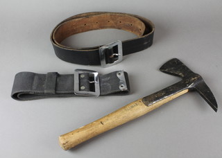 A fireman's axe marked Ewell, a leather belt and a webbing belt 