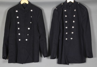 A Bristol Fire Brigade double breasted fireman's tunic together with a Ministry of Defence double breasted fireman's tunic