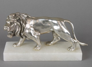 A chromed figure of a walking lion raised on a marble base 5"