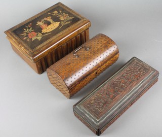 An arched rosewood and studded trinket box 3" x 8 1/2" x 3 1/2", a rectangular carved hardwood box with hinged lid 2" x 10" x 4" and a cylindrical trinket box in the form of a book 3" x 10" x 7" 