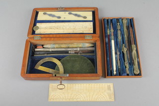 A Victorian rectangular mahogany geometry box containing an ivory gauge 6", a parallel ruler and other geometry instruments