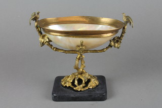 A mother of pearl oval bowl with gilt metal mounts raised on a black marble base 5" high 