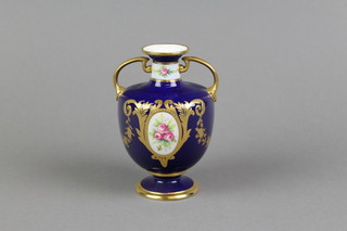A Mintons baluster 2 handled vase, the dark blue ground with panels of roses within gilt floral decoration 5 1/2" 