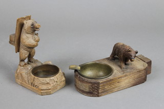 2 Swiss carved wooden ashtrays in the form of standing bears incorporating match stands 6" 