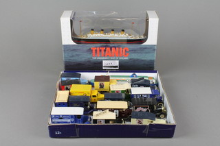 A Claytons model of The Titanic and a small collection of various cars 