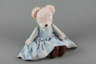 A Margaret Evans fabric bear dressed in costume 15"