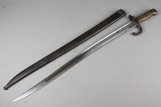 A French chassepot bayonet, the blade engraved and dated 1874 complete with scabbard 