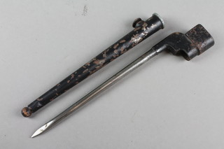 A pig-stick bayonet with metal scabbard marked MK1.S.286