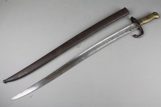 A French chassepot bayonet with brass grip, the back of bladed dated 1874 complete with metal scabbard