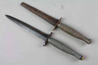 2 reproduction Fairbairn and Sykes fighting knives (1 tip of blade f)