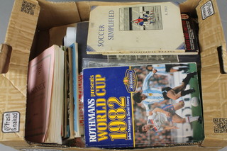 A box of various sporting programmes 