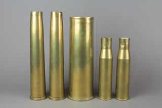 A WWI 18lbs brass shell case dated 1916, 2 40mm anti aircraft shell cases dated 1943 and 2 37mm shell cases dated 1942 