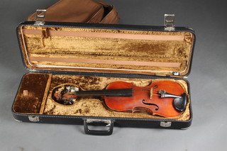 A violin with 2 piece back 14 1/2", bears label Thos. Hesketh of Manchester together with a bow and carrying case  