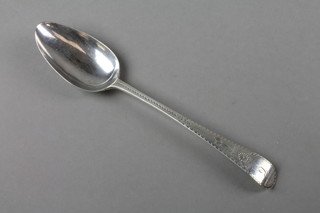 A Georgian silver bright cut tablespoon with monogram, London 1787, 54 grams