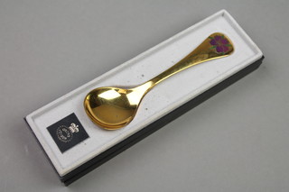 A Georg Jensen silver gilt and enamel spoon, cased, approx 44 grams