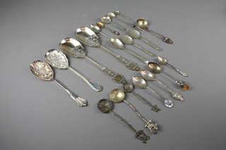 A small collection of silver souvenir spoons, 76 grams, a pair of berry spoons, serving spoons, etc, 