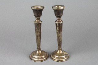 A pair of silver tapered candlesticks, Birmingham 1923 