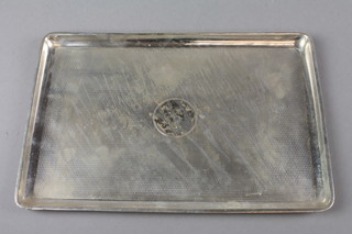 A rounded rectangular engine turned silver dressing table tray with engraved monogram, Birmingham 1946, approx 318 grams