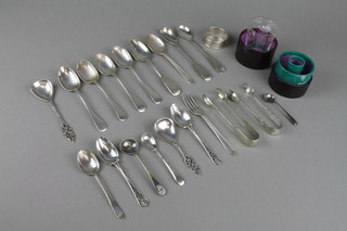 A silver napkin ring, 9 silver spoons, a fork, a glass medicine measure and minor items