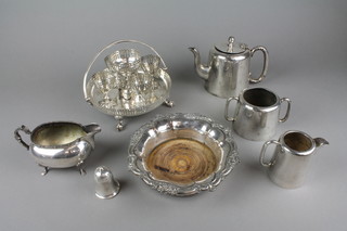 An Edwardian silver plated egg cup set, a ditto coaster and other minor items