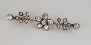 A Victorian gold and diamond floral bar brooch with brilliant cut terminals