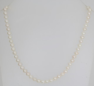 A strand of cultured pearls with a silver clasp