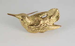 A 9ct gold brooch in the form of a woodcock with a gem set eye, approx. 6.2 grams