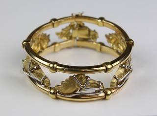 A fine Continental 18ct yellow and white gold open articulated bracelet set with 6 racing horse heads each with diamond set eyes, approx. 80grams