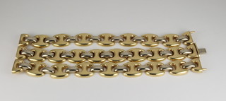 A 14ct 2 colour gold, 3 strand, flat link bracelet, approx. 68 grams