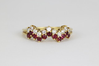 An 18ct yellow gold ruby and diamond half hoop ring, size L 1/2