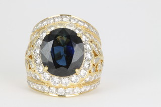 An 18ct yellow gold diamond and sapphire dress ring, approx. 16 grams, size M 1/2