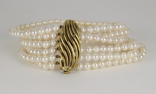 A 6 strand cultured pearl bracelet with a 14ct gold clasp