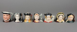 7 Royal Doulton character jugs - Jane Seymour D6747 3 1/2", Catherine of Aragon D6658 3 1/2", Anne of Cleeves D6754 2 1/2", Catherine Howard D6693 2 1/2", Anne Boleyn D6651 2 1/2", Catherine Parr D6755 5" and Henry VIII D6648 2 1/2"  